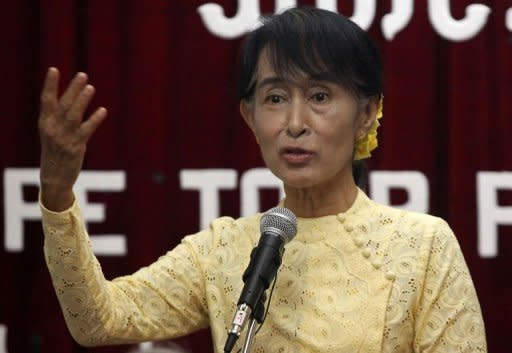 Myanmar opposition leader Aung San Suu Kyi speaks to the media during a press conference at the National League for Democracy Party headquarters in Yangon on July 3. Several hardliners will leave Myanmar's top leadership in an imminent reshuffle as the reformist regime welcomed the parliamentary debut of Suu Kyi's opposition