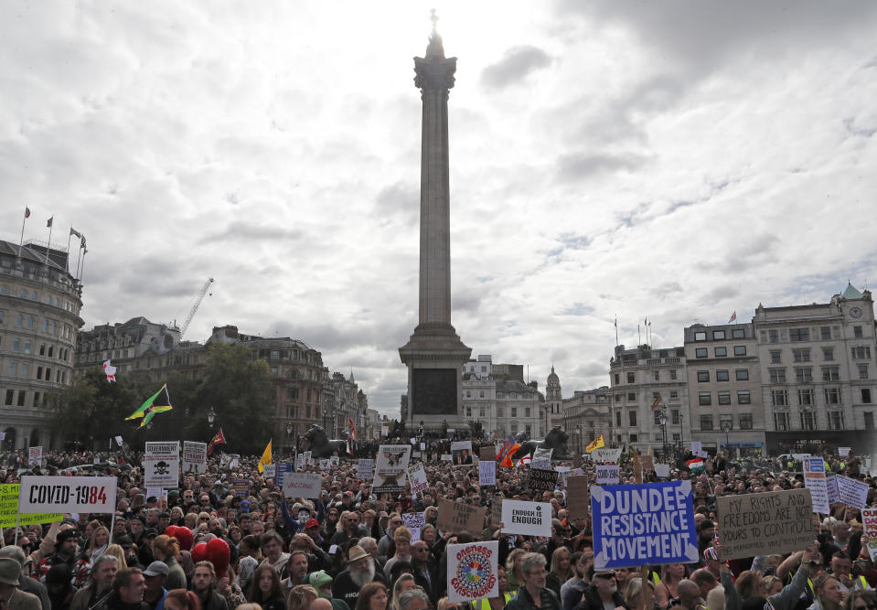 People take part in a 'We Do Not Consent' rally at Trafalgar Square, organised by Stop New Normal, to protest against coronavirus restrictions, in London, Saturday, Sept. 26, 2020. (AP Photo/Frank Augstein)