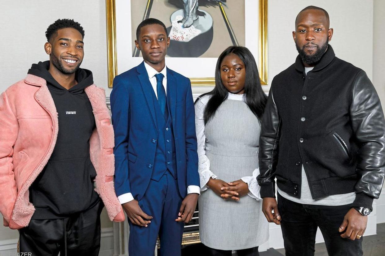 Support: Tinie Tempah, far left, and Dumi Oburota, far right, with Chase Cowans, 16, and Abi Akinboboye, 25, who have both secured work experience: Grant Frazer