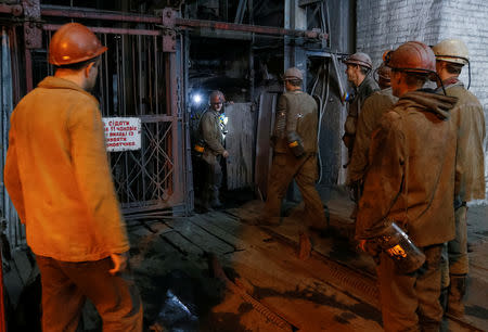 Miners wait to enter an elevator before descending into the Novovolynska-9 coal mine in Novovolynsk, Ukraine August 2, 2018. Picture taken August 2, 2018. REUTERS/Valentyn Ogirenko