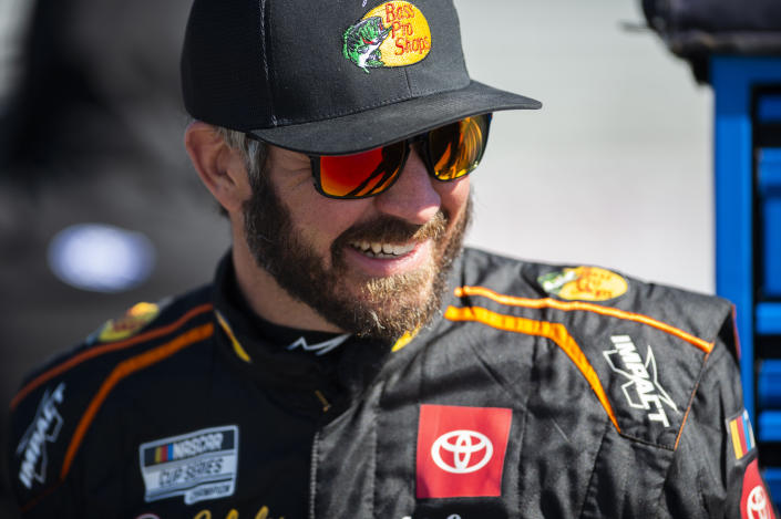 Driver Martin Truex, Jr. smiles before qualifying for the NASCAR Cup Series auto race at Atlanta Motor Speedway on Saturday, March 18, 2023, in Hampton, Ga. (AP Photo/Hakim Wright Sr.)
