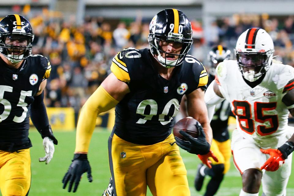 T.J. Watt #90 of the Pittsburgh Steelers returns a fumble for a touchdown against the Cleveland Browns during the fourth quarter at Acrisure Stadium on September 18, 2023 in Pittsburgh, Pennsylvania.