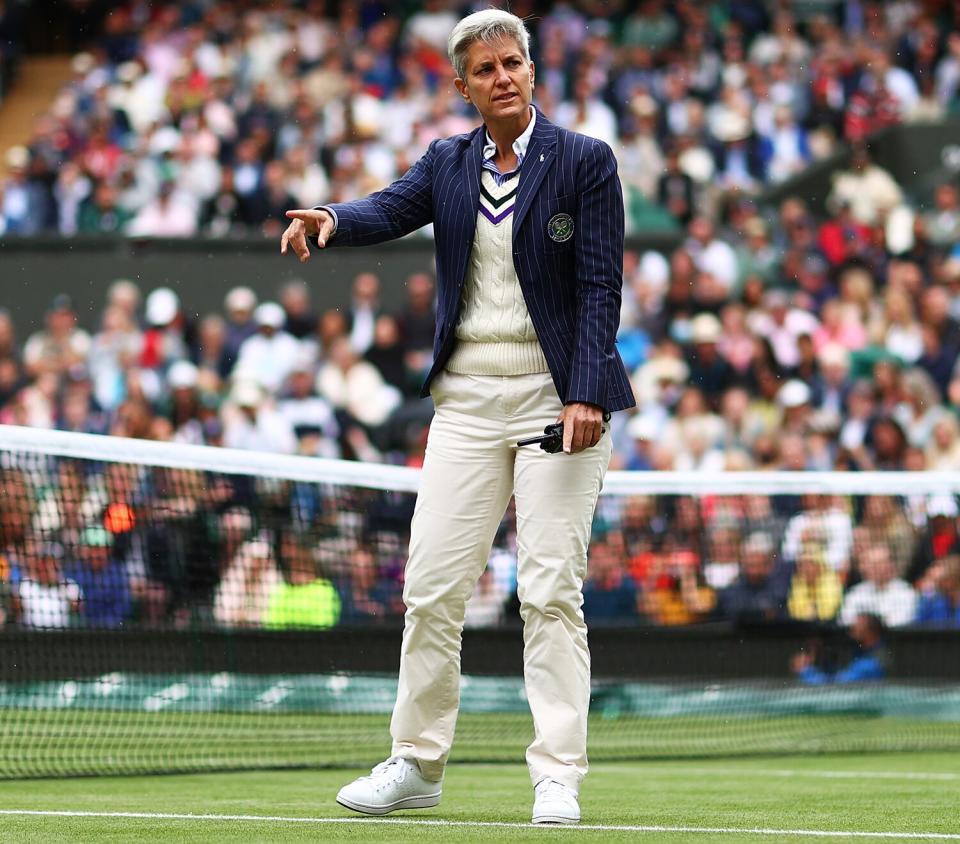 Umpire Marija Cicak of Croatia as the players go off for a rain delay in his Men's Singles Fourth Round match against Lorenzo Sonego of Italy during Day Seven of The Championships - Wimbledon 2021 at All England Lawn Tennis and Croquet Club on July 05, 2021 in London, England.