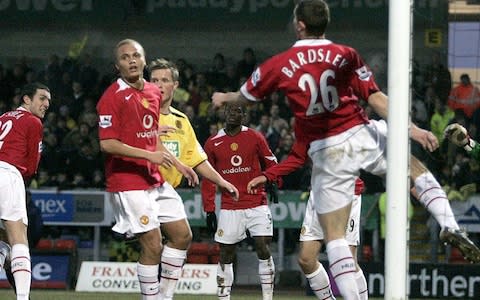 Manchester United's Phil Bardsley, number 26, clears a header of his own line after a Burton Albion corner during their English FA Cup 3rd round soccer match at The Pirelli Stadium, Burton-on-Trent, England, Sunday Jan. 8, 2006 - Credit: AP