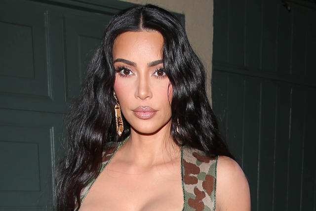 Kim Kardashian Elevates Hosiery in a Camo Bralette, Silky Tights &  Invisible Pumps
