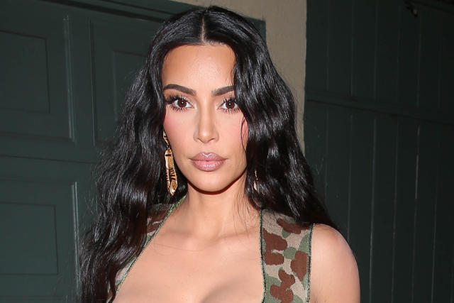 Kim Kardashian Elevates Hosiery in a Camo Bralette, Silky Tights & Invisible  Pumps