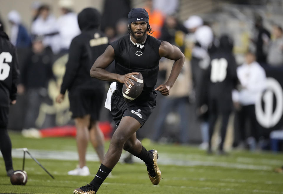 Colorado quarterback Shedeur Sanders warms up for the team's NCAA college football game against Stanford on Friday, Oct. 13, 2023, in Boulder, Colo. (AP Photo/David Zalubowski)