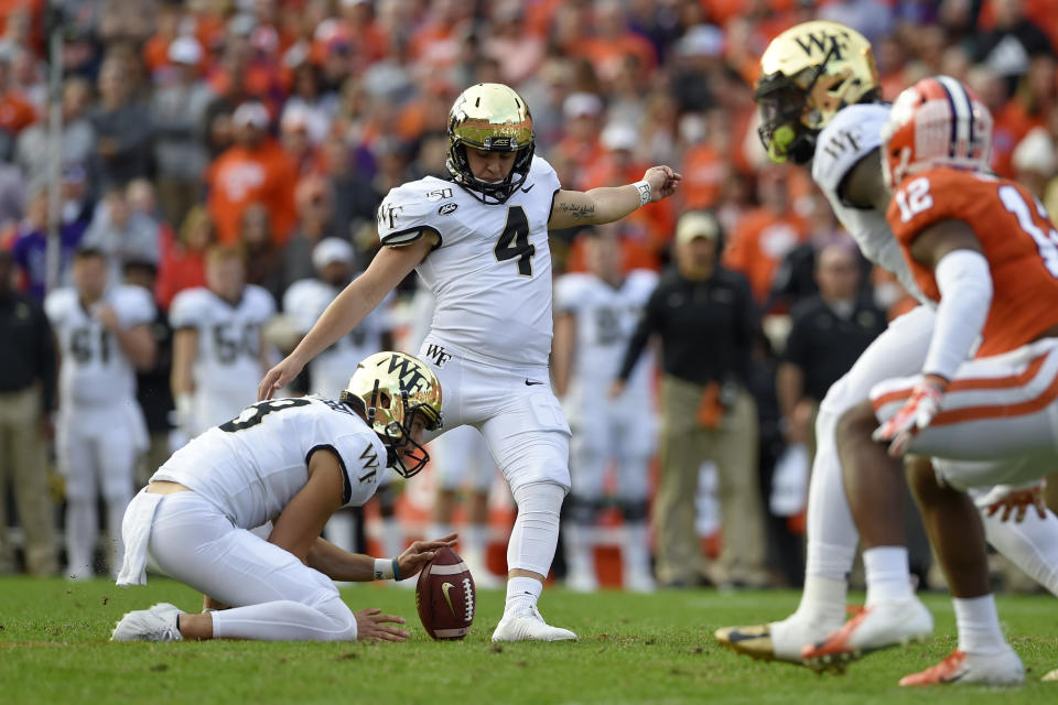 Wake Forest's Nick Sciba (4), with Dom Maggio holding, boots a field goal during the first half of an NCAA college football game against Clemson, Saturday, Nov. 16, 2019, in Clemson, S.C. (AP Photo/Richard Shiro)
