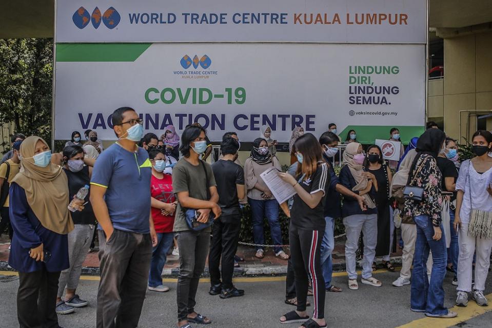 People wait to receive their AstraZeneca Covid-19 vaccine shot at the Vaccine Delivery Centre located at Kuala Lumpur World Trade Centre May 29, 2021. — Picture by Hari Anggara