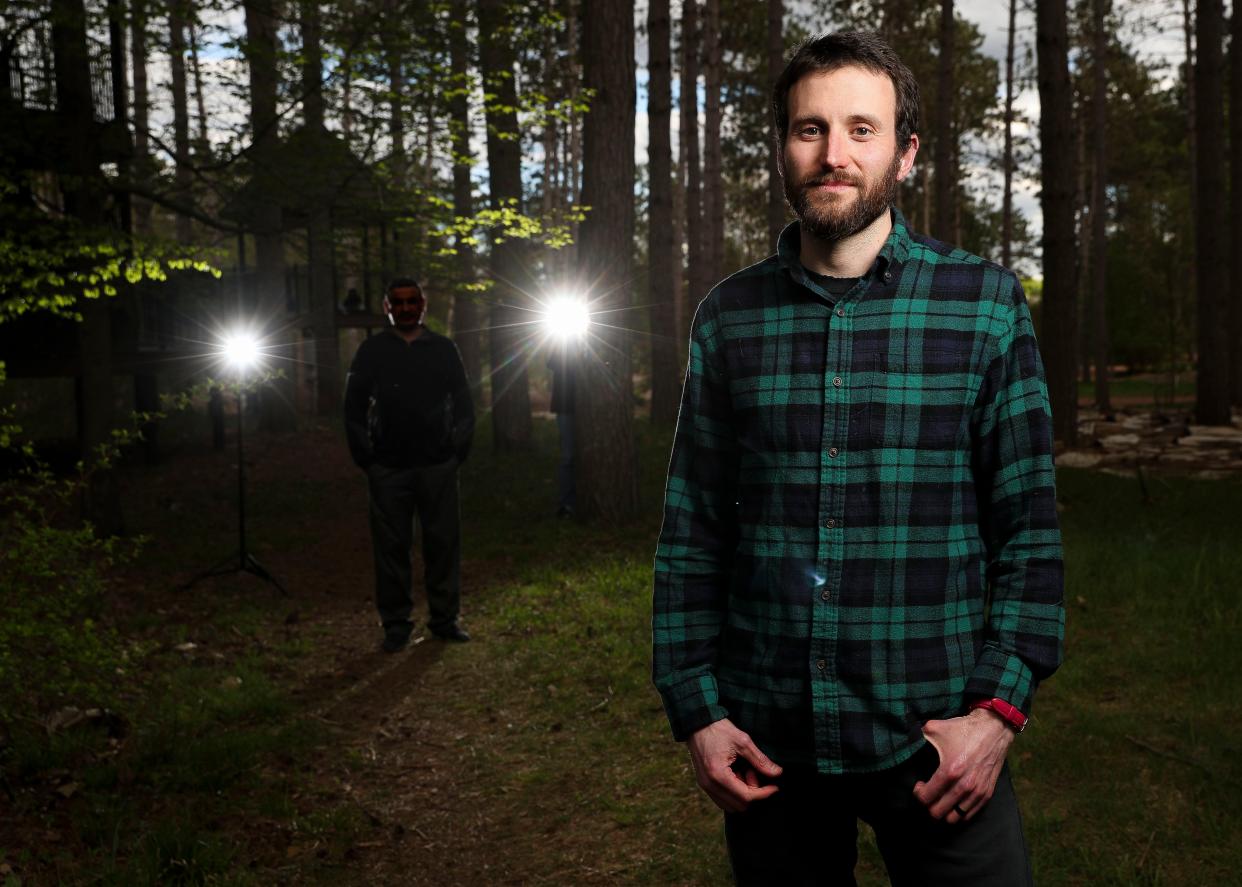 Jonathan Bressler, shown at Monk Botanical Gardens in Wausau, has helped an Afghanistan refugee family settle into the city since they arrived in January.