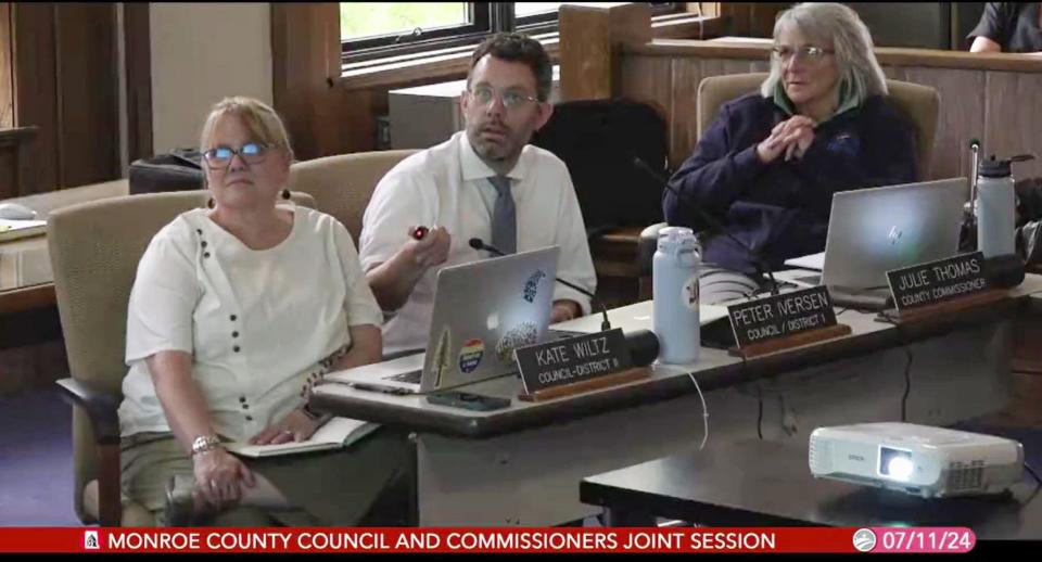 Monroe County Council members Kate Wiltz and Peter Iversen and Monroe County Commissioner Julie Thomas attempt to sort jail inmates during an exercise at a joint meeting on July 11, 2024.