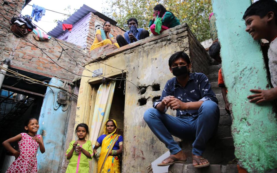 Up to twelve people share can one room in the Sarai Kale Khan slum in New Delhi - Cheena Kapoor