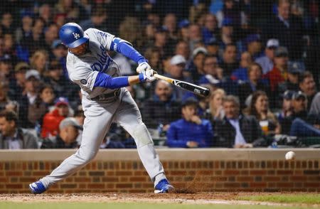 FILE PHOTO: Apr 24, 2019; Chicago, IL, USA; Los Angeles Dodgers center fielder A.J. Pollock (11) singles against the Chicago Cubs during the sixth inning at Wrigley Field. Mandatory Credit: Kamil Krzaczynski-USA TODAY Sports