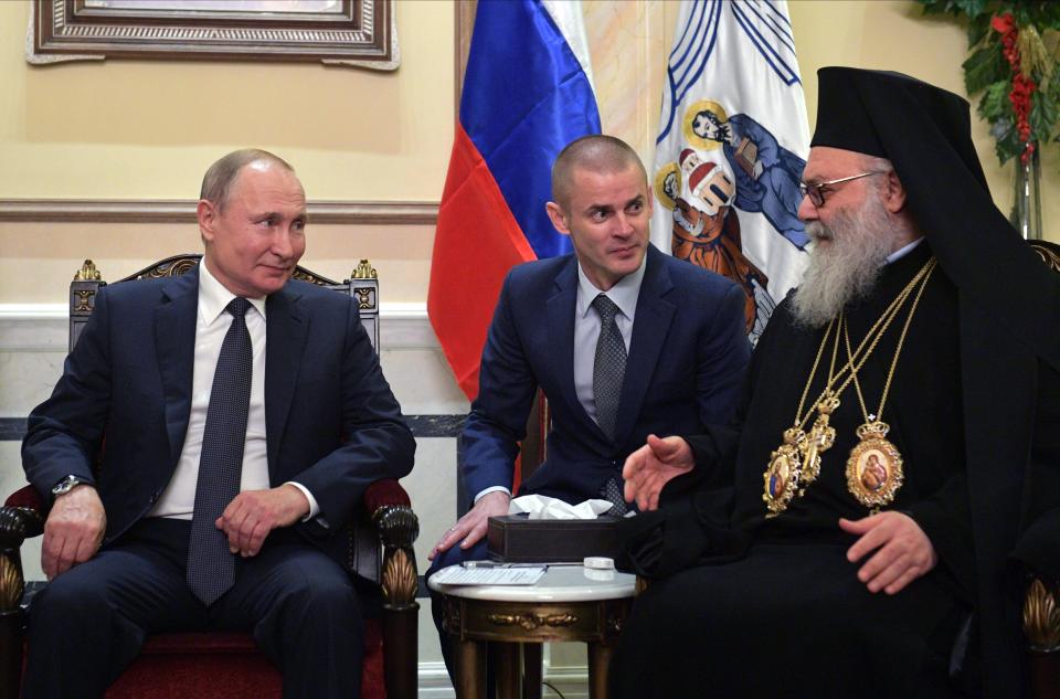 Russian President Vladimir Putin, left, listens to Greek Orthodox Patriarch of Antioch and All the East during their talks in Damascus, Syria, Tuesday, Jan. 7, 2020. Putin has traveled to Syria to meet with President Bashar Assad, a key Iranian ally. The rare visit Tuesday comes amid soaring tensions between Iran and the United States following the U.S. drone strike last week that killed a top Iranian general who led forces supporting Assad in Syria's civil war. (Alexei Druzhinin, Sputnik, Kremlin Pool Photo via AP)