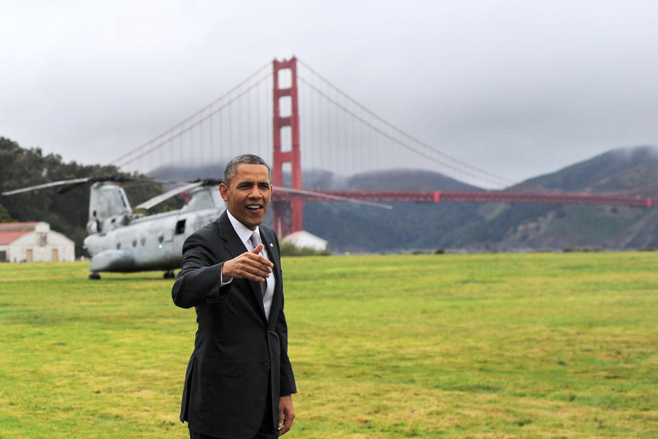 US President Barack Obama smiles before boarding Marine One helicopter from a field overlooking the iconic golden gate bridge in San Francisco, California, on April 4, 2013. Obama is in California to attend two DCCC fund rising events. AFP PHOTO/Jewel Samad        