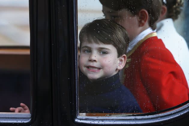 Louis smiles through the window as he travels with his family back to Buckingham Palace from Westminster Abbey on May 6. 