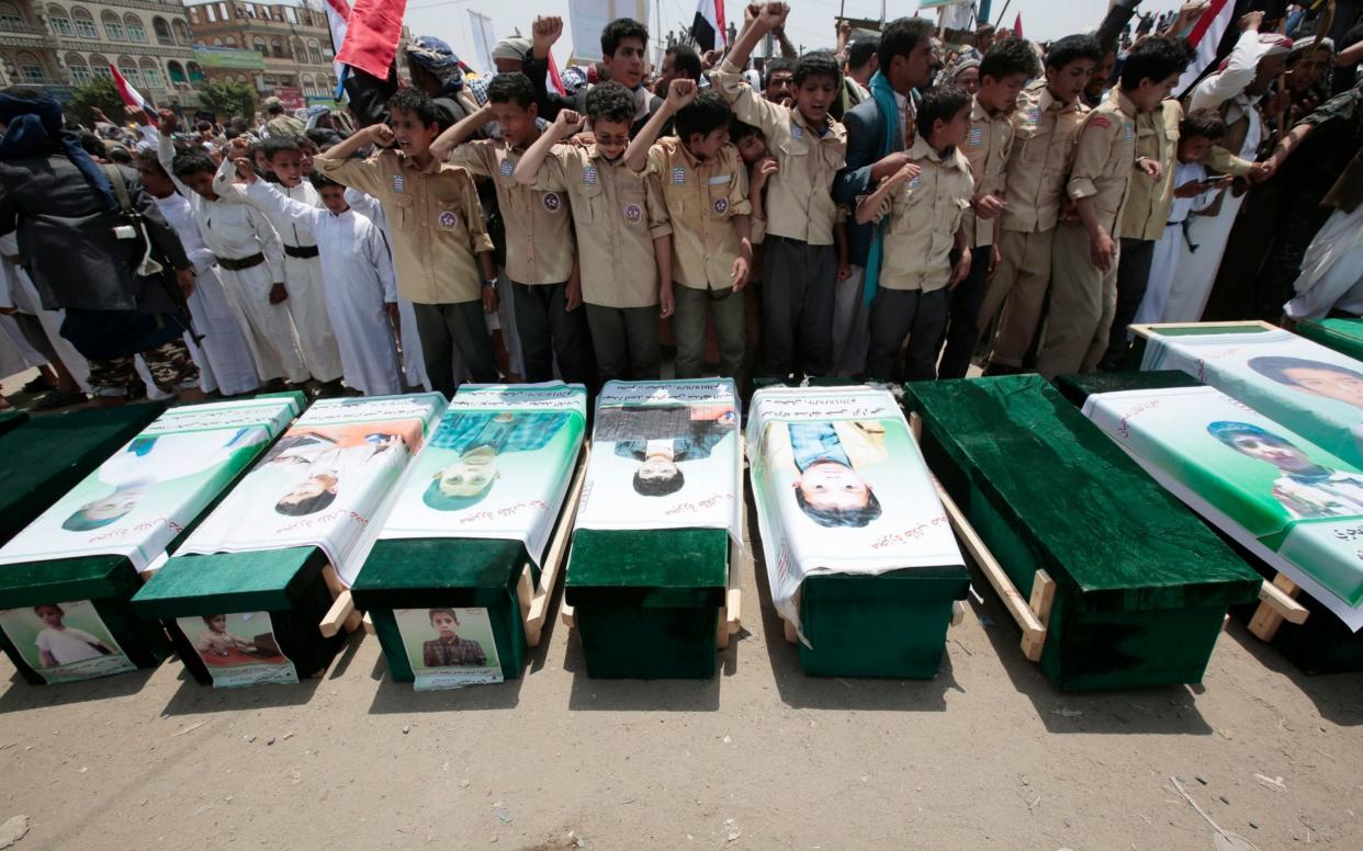 Mourners attend the funeral of victims of a Saudi-led airstrike, in Saada, Yemen - AP