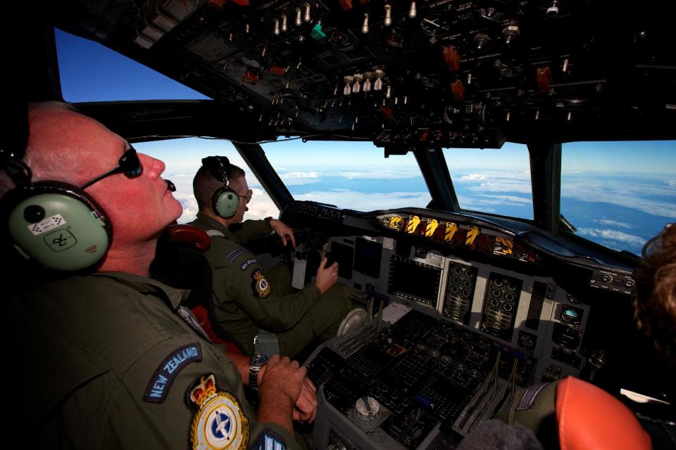 A Royal New Zealand Air Force P-3 Orion is flown by Flt. Lt Tim McAlevey back, in the search for missing Malaysia Airlines Flight MH370 over the Indian Ocean, Friday, April 11, 2014. Authorities are confident that signals detected deep in the Indian Ocean are from the missing Malaysian jet's black boxes, Australia's Prime Minister Tony Abbott said Friday, raising hopes they are close to solving one of aviation's most perplexing mysteries. (AP Photo/Richard Wainwright, Pool)