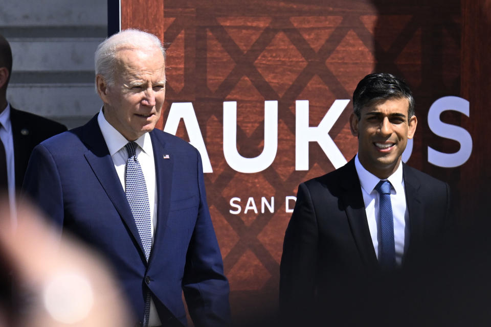 President Joe Biden, left, and British Prime Minister Rishi Sunak arrive at Naval Base Point Loma, Monday, March 13, 2023, in San Diego, as they unveil, AUKUS, a trilateral security pact between Australia, Britain, and the United States. (AP Photo/Denis Poroy)