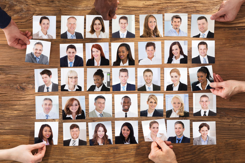 Businesspeople Hand Selecting The Candidate Portrait Photo For Hiring In Job