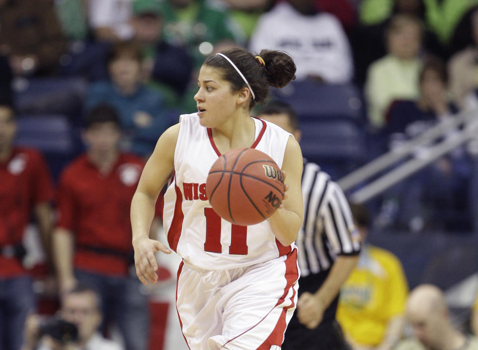 FILE - In this Sunday, March 21, 2010 file photo, Wisconsin's Rae Lin D'Alie in the second half of an NCAA first-round college basketball game in South Bend, Ind. Rae Lin D'Alie was born and raised in Wisconsin but is the star of Italy's 3-on-3 basketball team at the Tokyo Olympics. “Rae Rae” as she is known usually is the shortest player on the court at 5-foot-3 but is Italy's spark plug and court general. (AP Photo/Michael Conroy, File)