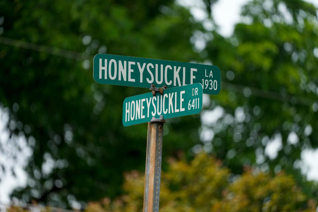 A street sign identifies the intersection of Honeysuckle Lane and Honeysuckle Drive in the Mt. Washington neighborhood of Cincinnati on Sunday, June 4, 2023