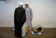 Star Jaber Al-Busaisi (C), 58, a teacher at Ibn al-Fahd al-Heli school run by al-Hawza al-Ilmiyya, speaks to the principal of the school, in Kerbala, Iraq, August 4, 2017. For more than 1,000 years, the al-Hawza al-Ilmiyya in southern Baghdad has been giving religious instructions to thousands of Shi'ite Muslims to help them become clerics. REUTERS/Abdullah Dhiaa Al-deen