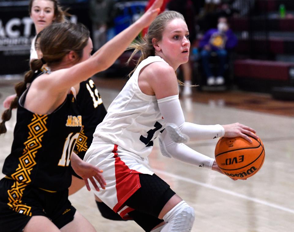 Jim Ned guard Ashlynn Galvin is covered by Seminole's Channing Howard during the championship game of the Pug Parris Classic Nov. 19 at McMurry's Kimbrell Arena.