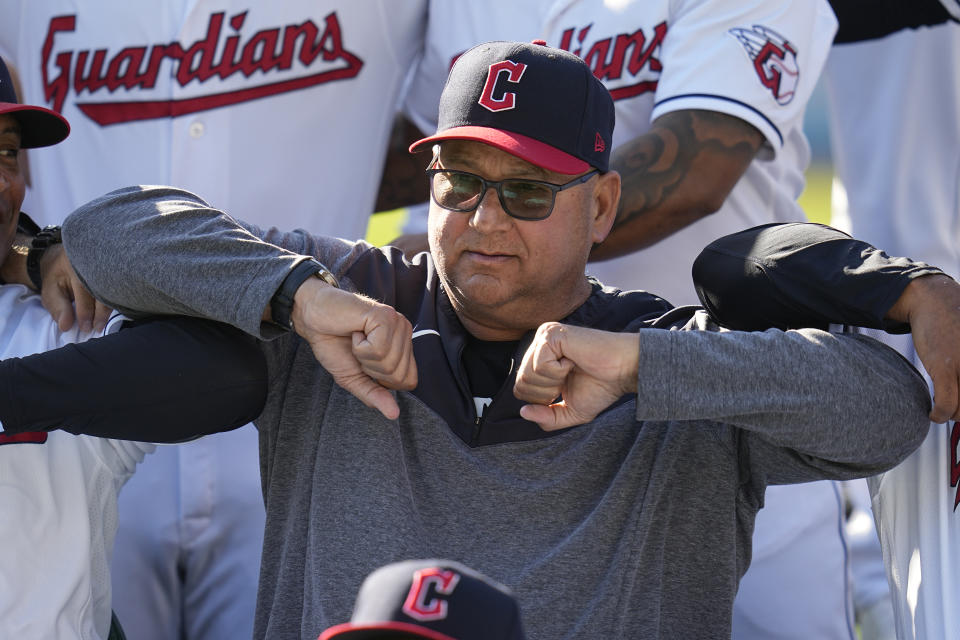 Cleveland Guardians manager Terry Francona, center, poses with the team for a photo before a baseball game against the Baltimore Orioles Friday, Sept. 22, 2023, in Cleveland. Slowed by major health issues in recent years, the personable, popular Francona may be stepping away, but not before leaving a lasting imprint as a manager and as one of the game's most beloved figures.(AP Photo/Sue Ogrocki)