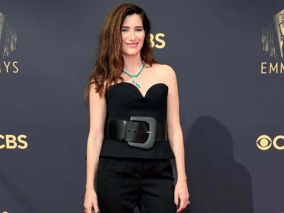 Kathryn Hahn wears a black jumpsuit on the Emmys red carpet.