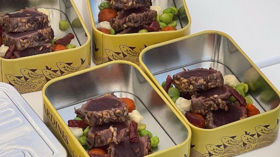 Presentation also counted. These ornate sardine cans made good picnic containers for the seared tuna. - Credit: Courtesy MYBA