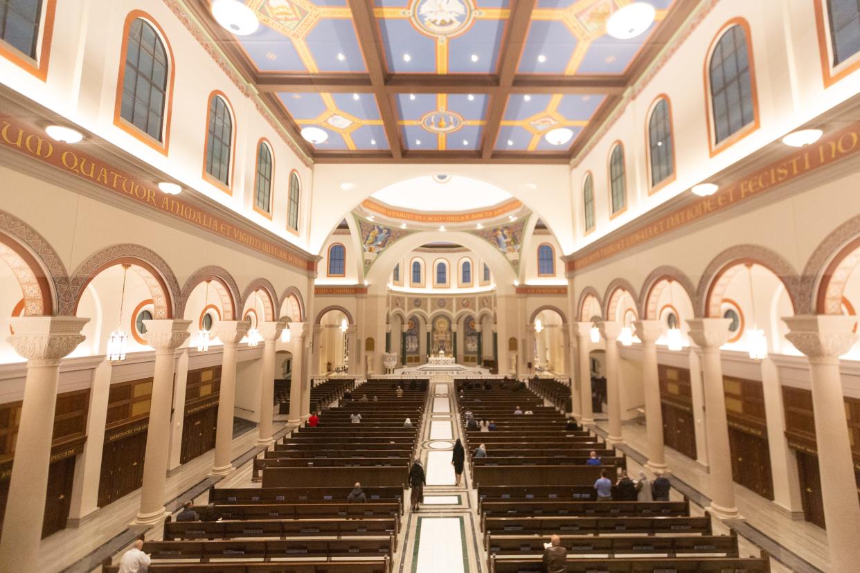 Parish members find their seats at the Immaculata Church in St. Mary's during morning mass on March 13. The church has a capacity of 1,550.