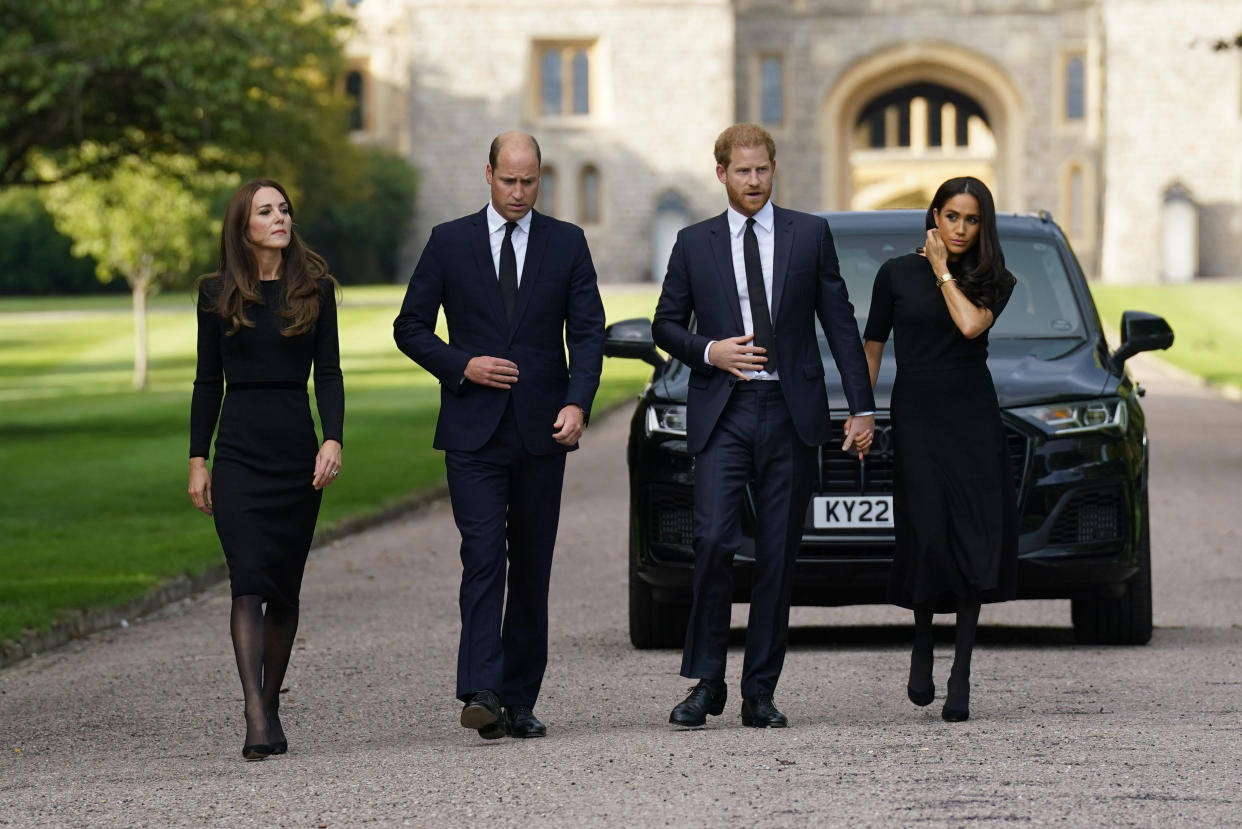 FILE - From left, Kate, the Princess of Wales, Prince William, Prince of Wales, Prince Harry and Meghan, Duchess of Sussex walk to meet members of the public at Windsor Castle, following the death of Queen Elizabeth II on Thursday., in Windsor, England, Saturday, Sept. 10, 2022. Prince Harry and his wife, Meghan, are expected to vent their grievances against the monarchy when Netflix releases the final episodes of a series about the couple’s decision to step away from royal duties and make a new start in America.(Kirsty O'Connor/Pool Photo via AP, File)
