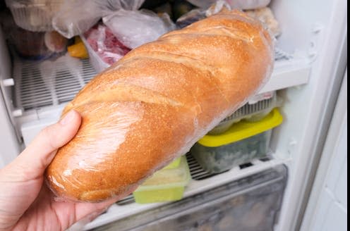 <span class="caption">Freezing bread causes the starches it contains to turn into resistant starches.</span> <span class="attribution"><a class="link " href="https://www.shutterstock.com/image-photo/hand-putting-loaf-wheat-bread-reserve-1873565644" rel="nofollow noopener" target="_blank" data-ylk="slk:Nadezhda Mikhalitskaia/ Shutterstock;elm:context_link;itc:0;sec:content-canvas">Nadezhda Mikhalitskaia/ Shutterstock</a></span>