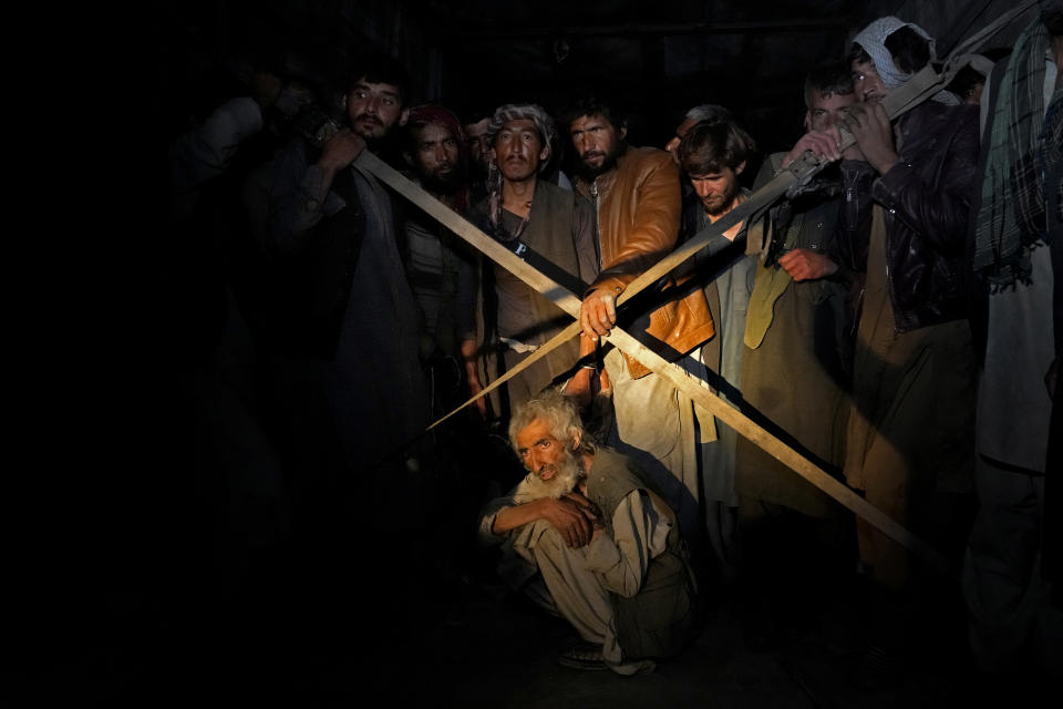 Afghan drug addicts who were rounded up during a Taliban raid are waiting in a truck to be taken to a drug treatment camp, in Kabul, Afghanistan, Thursday, June 2, 2022. Drug addiction has long been a problem in Afghanistan, the world’s biggest producer of opium and heroin. The ranks of the addicted have been fueled by persistent poverty and by decades of war that left few families unscarred. (AP Photo/Ebrahim Noroozi)