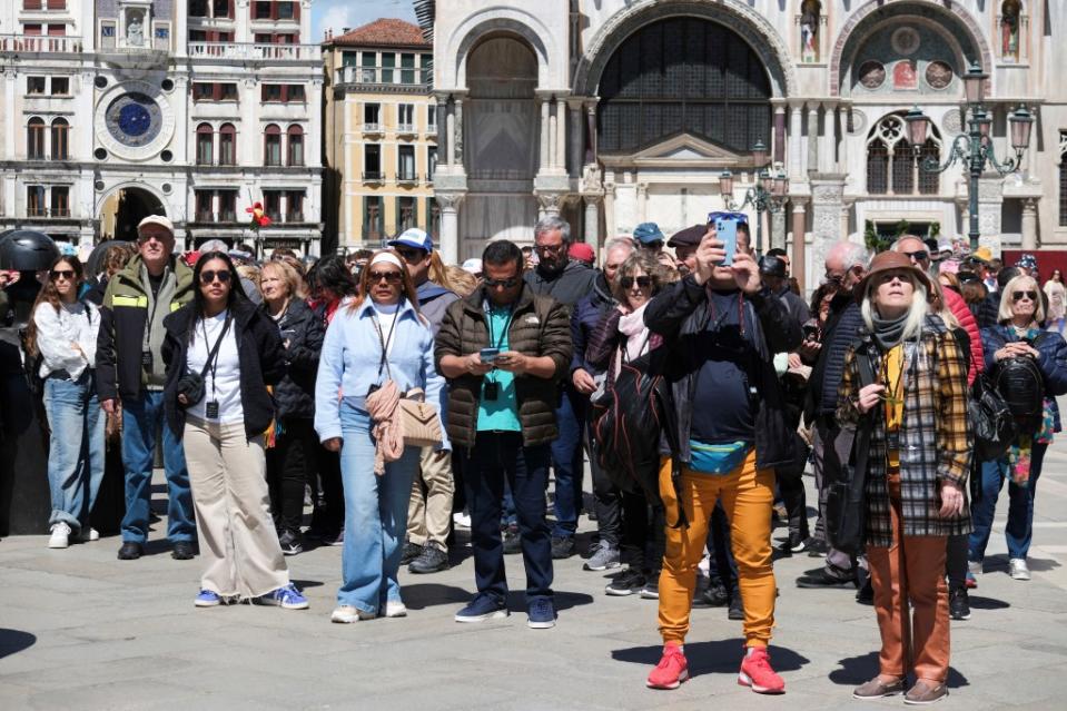 Tourists continued to flood into St. Marks Square on Thursday. REUTERS