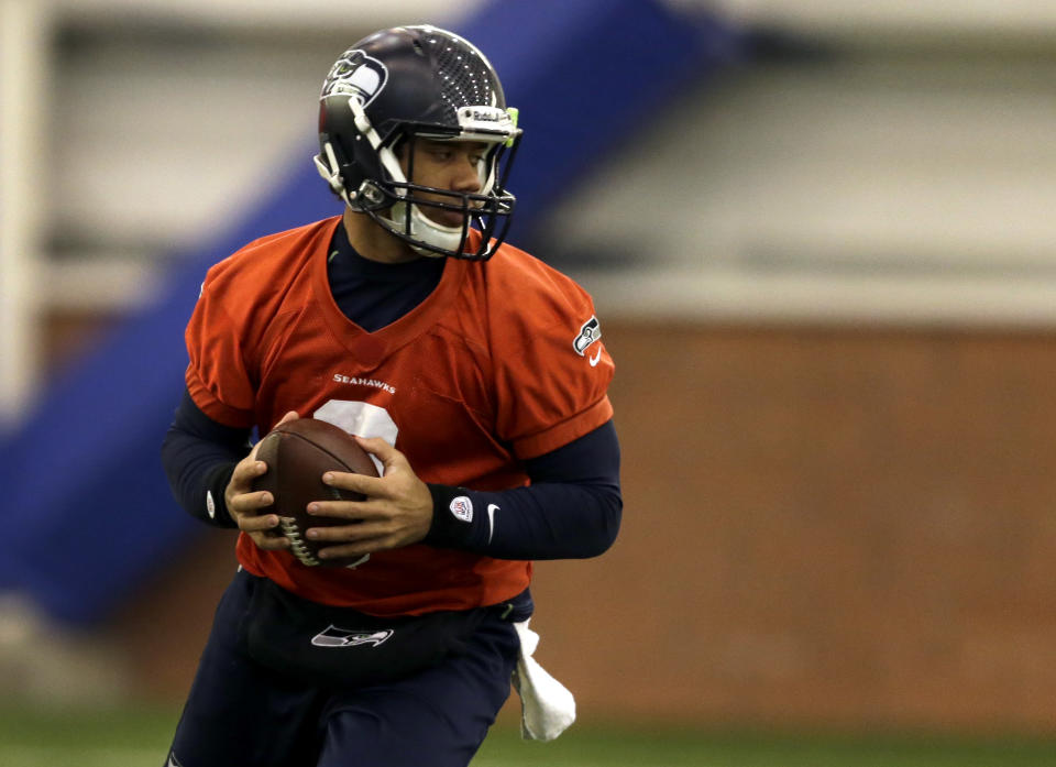Seattle Seahawks quarterback Russell Wilson drops back during NFL football practice Thursday, Jan. 30, 2014, in East Rutherford, N.J. The Seahawks and the Denver Broncos are scheduled to play in the Super Bowl XLVIII football game Sunday, Feb. 2, 2014. (AP Photo)