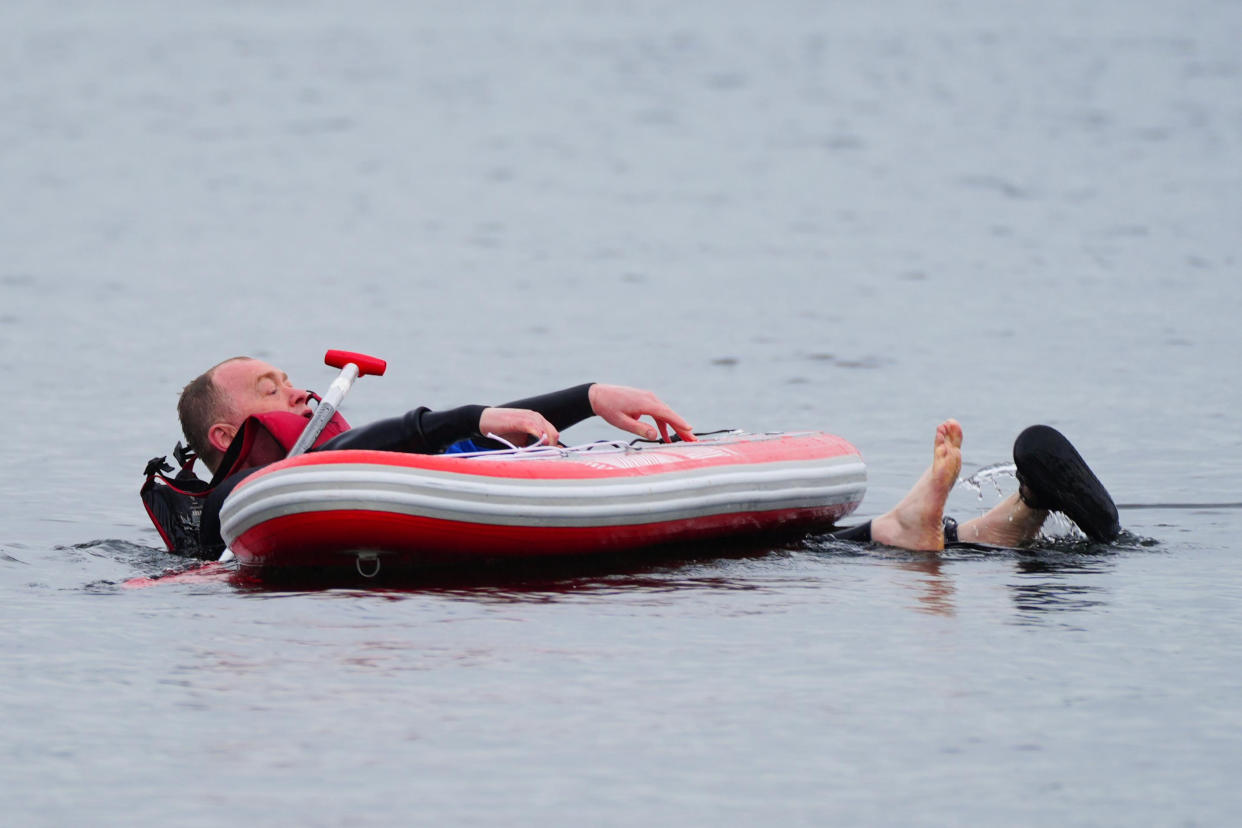 Lib Dem candidate Tim Farron discovers that getting back on a paddleboard on Lake Windermere is much harder than falling off (Peter Byrne/PA)