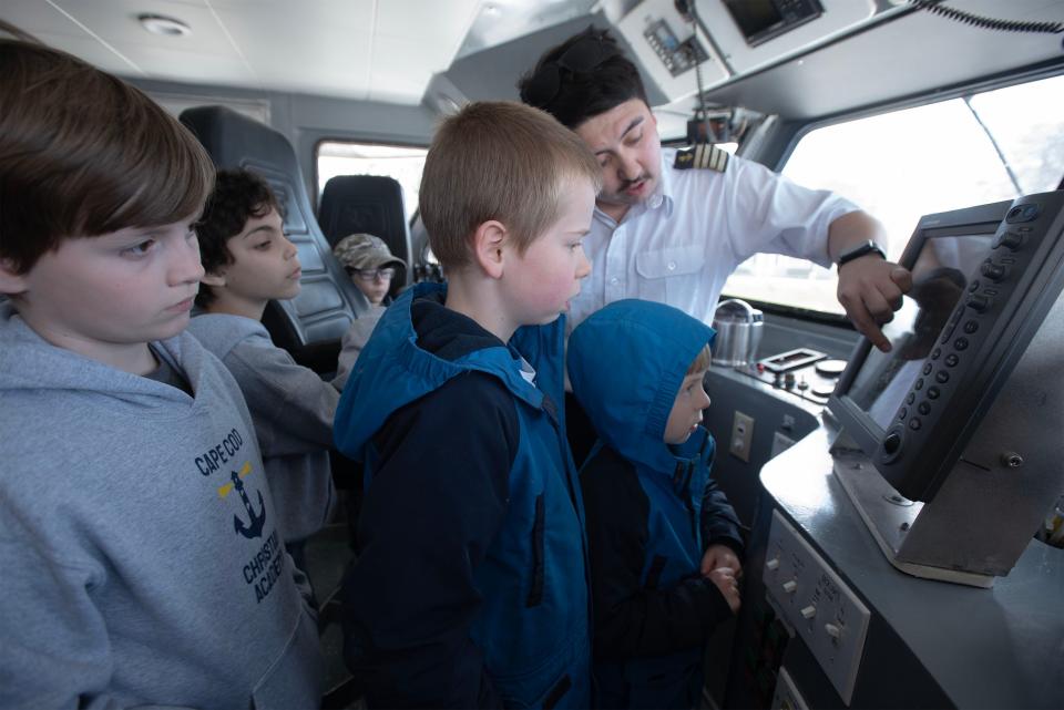 Captain Mike Lambias explains the ship's radar system to students from the Cape Cod Christian Academy aboard the Hy-Line's ferry Vineyard Lady during a tour and harbor cruise.