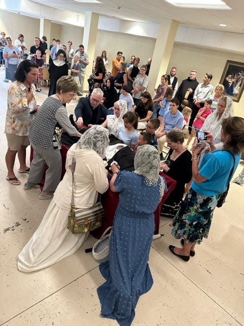 Photos taken by Lori Rosebrough shows a gathering of people who flocked to Gower, Missouri, to visit the recently exhumed body of Sister Wilhelmina Lancaster, OSB, whose remains have shocked believers.