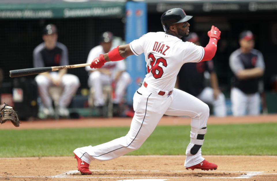 FILE - In this Aug. 19, 2018, file photo, Cleveland Indians' Yandy Diaz hits a one-run double off Baltimore Orioles starting pitcher Yefry Ramirez in the first inning of a baseball game, in Cleveland. Encarnacion has been traded to Seattle and first baseman Carlos Santana has returned to the Indians in a three-team deal that also involved Tampa Bay. The Rays got infielder Yandy Diaz and minor league right-hander Cole Slusser from Cleveland. The Indians also acquired first baseman Jake Bauers. The swap came Thursday, Dec. 13, 2018, at the close of the winter meetings. (AP Photo/Tony Dejak)