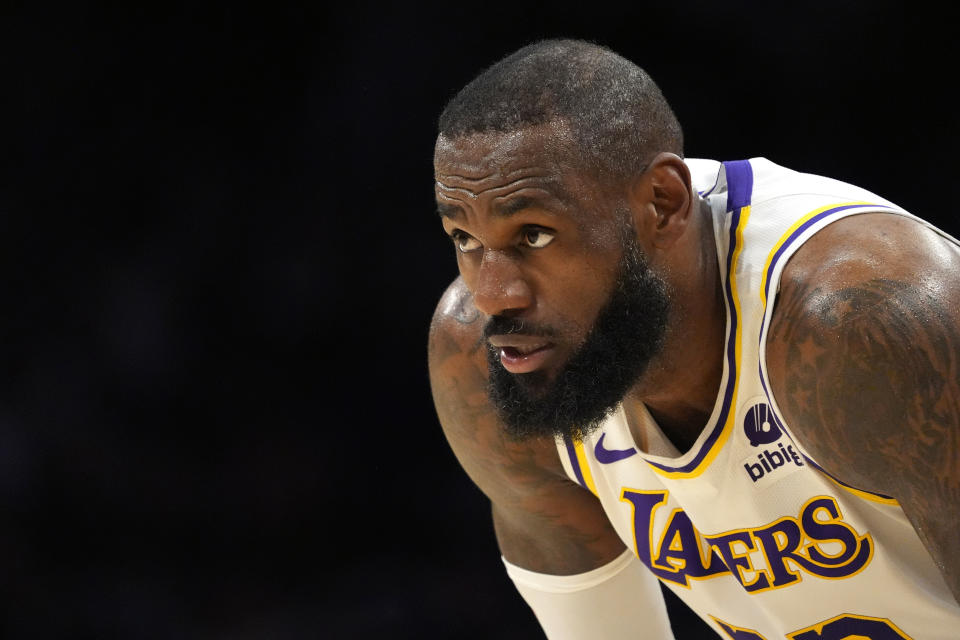 Los Angeles Lakers forward LeBron James rests on the court during the first half of Game 4 of an NBA basketball first-round playoff series against the Denver Nuggets on Saturday, April 27, 2024, in Los Angeles.  (AP Photo/Mark J. Terrill)