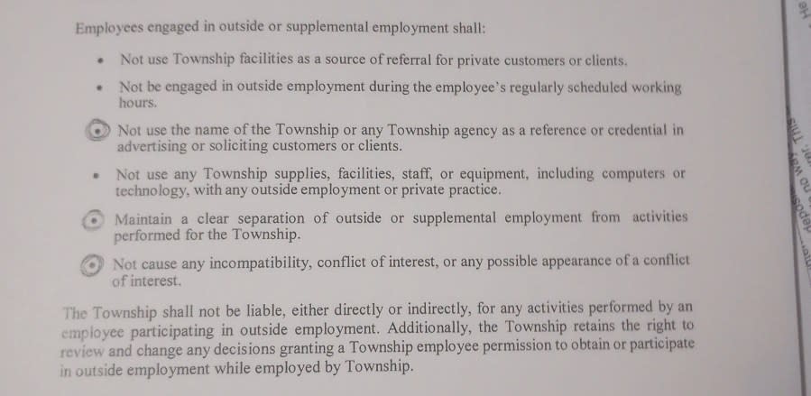 A portion of the Meridian Township Employee Handbook on outside employment. (Photo by WLNS)