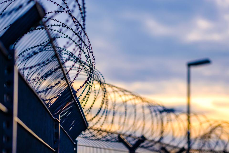 Barbed wire prison.