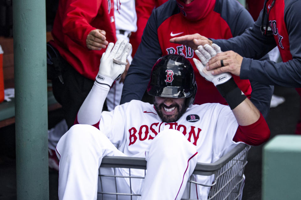 BOSTON, MA - APRIL 19: J.D. Martinez #28 of the Boston Red Sox reacts as he is pushed in a laundry cart after hitting a solo home during the second inning of a game against the Chicago White Sox on April 19, 2021 at Fenway Park in Boston, Massachusetts. (Photo by Billie Weiss/Boston Red Sox/Getty Images)