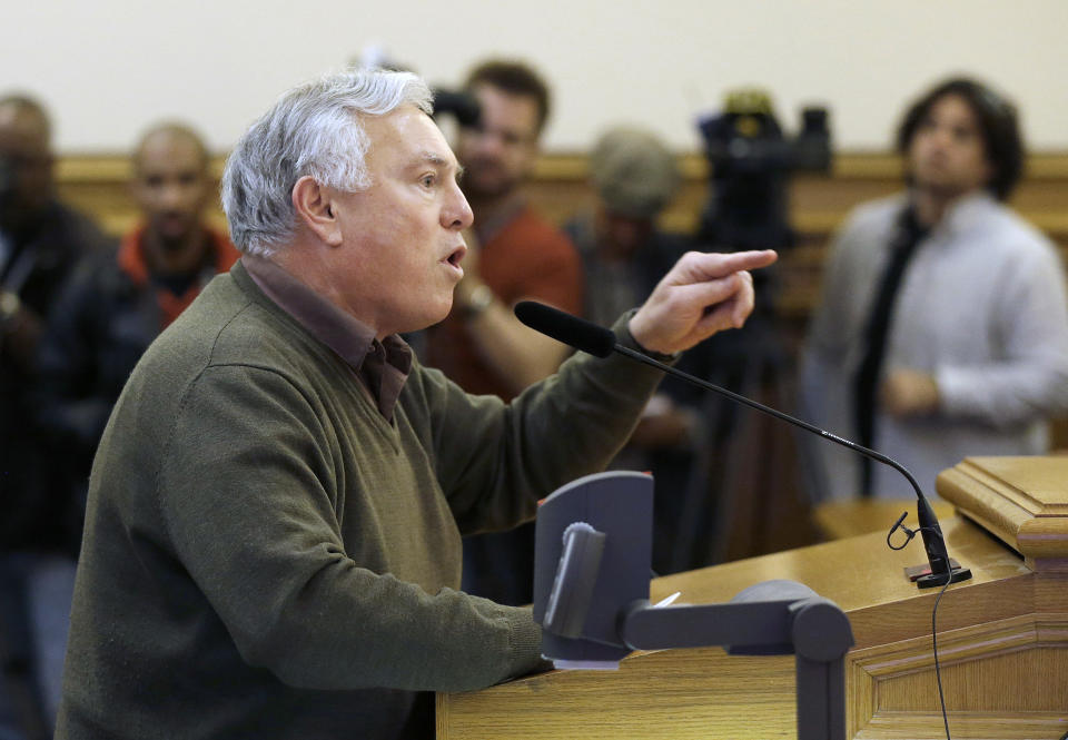 Steve Zeltzer speaks against employee shuttles Tuesday, Jan. 21, 2014, before the San Francisco Municipal Transportation Authority board of directors at a SFMTA meeting at City Hall in San Francisco. San Francisco officials voted in favor of a proposal to start regulating employee shuttles for companies like Google, Facebook and Apple, charging a fee for those that use public bus stops and controlling where they load and unload. Private shuttle buses have created traffic problems, blocking public bus stops during peak commute hours. (AP Photo/Jeff Chiu)