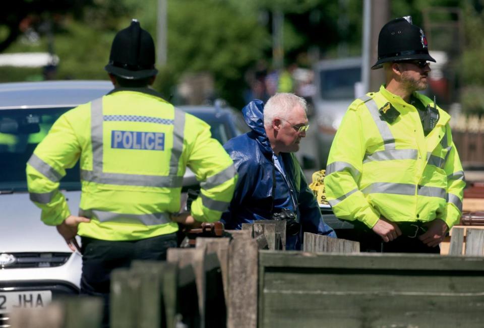 Police at the suspect's address in Elsmore Road (PA)