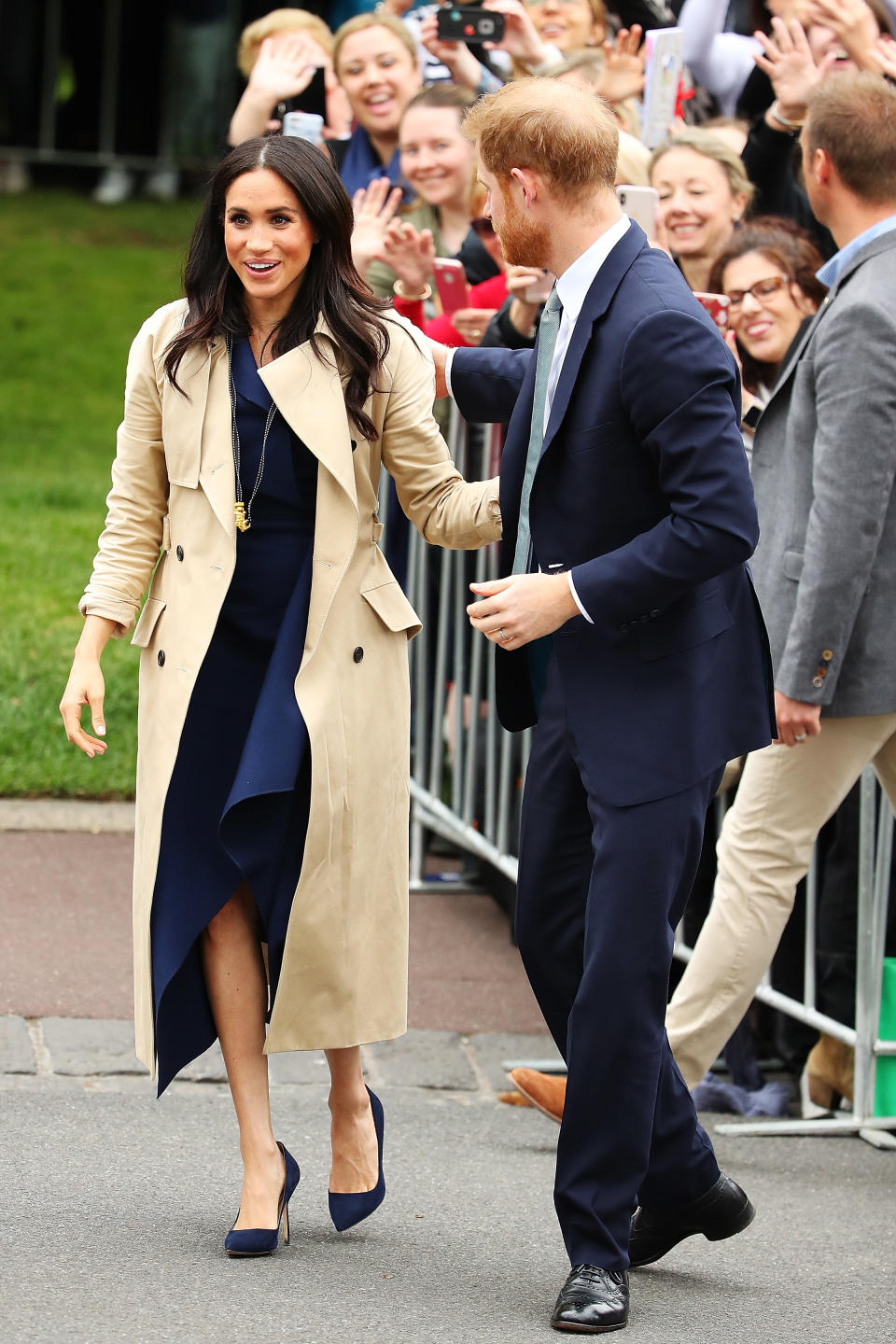 <p>Heading to Melbourne on Thursday, the Duchess of Sussex opted for a classic navy frock by Australian designer Dion Lee. Photo: Getty </p>