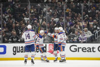 Edmonton Oilers left wing Zach Hyman (18) celebrates with teammates after scoring during the second period of Game 4 of an NHL hockey Stanley Cup first-round playoff series hockey game against the Los Angeles Kings Sunday, April 23, 2023, in Los Angeles. (AP Photo/Ashley Landis)