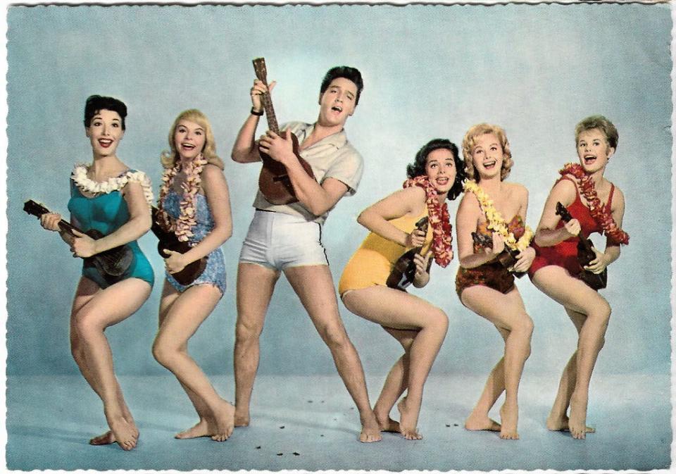 From the golden age of publicity photos, it's Elvis and girls! girls! girls! to promote "Blue Hawaii."